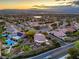 Stunning aerial view of a neighborhood, highlighting mountain views, mature landscaping, pools and putting greens at 2248 Carrizo Way, Henderson, NV 89052