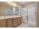 Primary bathroom featuring dual sinks, shower, and tile flooring at 2248 Carrizo Way, Henderson, NV 89052