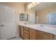 Bathroom with dual sinks, an oversized mirror, and ample lighting at 2248 Carrizo Way, Henderson, NV 89052