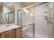 Bright bathroom features a glass shower enclosure and wooden vanity at 2248 Carrizo Way, Henderson, NV 89052