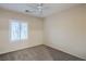 Neutral bedroom with plush carpeting and a modern ceiling fan at 2248 Carrizo Way, Henderson, NV 89052