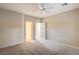 Large bedroom with neutral carpeting, ceiling fan and direct access to the bathroom at 2248 Carrizo Way, Henderson, NV 89052