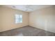 Neutral bedroom with plush carpeting and a modern ceiling fan at 2248 Carrizo Way, Henderson, NV 89052