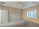 A modern and spacious bedroom with a ceiling fan and shuttered window at 2248 Carrizo Way, Henderson, NV 89052