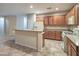 Open kitchen area with breakfast bar, tile flooring and stainless steel appliances at 2248 Carrizo Way, Henderson, NV 89052
