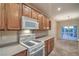 Well-equipped kitchen with wood cabinets and modern appliances perfect for any home chef at 2248 Carrizo Way, Henderson, NV 89052