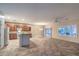 Open concept living space featuring tile flooring and a dining area with ample natural light at 2248 Carrizo Way, Henderson, NV 89052
