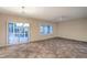 Bright living space with tile floors, fan, and large windows with natural light at 2248 Carrizo Way, Henderson, NV 89052