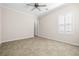 Bright bedroom with neutral colors, crown moulding, and tile flooring at 2373 Black River Falls Dr, Henderson, NV 89044