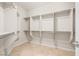 Walk-in closet with built-in shelving and hanging rods for ample storage at 2373 Black River Falls Dr, Henderson, NV 89044