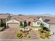 Charming single-story home with desert landscaping, brick entryway, and mountain views at 2373 Black River Falls Dr, Henderson, NV 89044