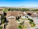 A well-maintained single-story house boasts a beautifully landscaped front yard and an inviting walkway at 2373 Black River Falls Dr, Henderson, NV 89044