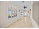 Inviting foyer with arched windows, tile flooring, and an elegant ceiling fan at 2373 Black River Falls Dr, Henderson, NV 89044