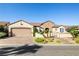 Charming single-story home featuring desert landscaping, a brick-paved driveway, and gated courtyard entry at 2373 Black River Falls Dr, Henderson, NV 89044