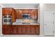 Traditional style kitchen features wood cabinets, granite countertops, and stainless steel appliances at 2373 Black River Falls Dr, Henderson, NV 89044