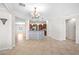 Spacious open-concept living room with tile flooring and bar area at 2373 Black River Falls Dr, Henderson, NV 89044