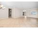 Spacious living room featuring a modern color palette, and an open transition to another room at 2373 Black River Falls Dr, Henderson, NV 89044
