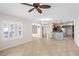 Bright and spacious living room showcasing an open concept design with views into the kitchen at 2373 Black River Falls Dr, Henderson, NV 89044