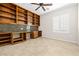 Office with custom built-in desk, shelves, and a large window for natural light at 2373 Black River Falls Dr, Henderson, NV 89044