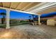Charming covered patio featuring custom stone table set and built-in outdoor grill at 2373 Black River Falls Dr, Henderson, NV 89044