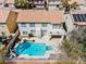 Aerial view showcasing backyard pool and spa and tiled roof at 2445 Antler Point Dr, Henderson, NV 89074