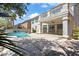 Expansive backyard with a pool, covered patio, and lush landscaping, perfect for relaxation and entertaining at 2445 Antler Point Dr, Henderson, NV 89074