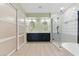Well-lit bathroom with a double vanity and a separate glass shower at 2445 Antler Point Dr, Henderson, NV 89074