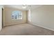 Bright bedroom with neutral carpet, shutters, ceiling fan and trim at 2445 Antler Point Dr, Henderson, NV 89074