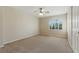 Bedroom with large window and neutral carpet at 2445 Antler Point Dr, Henderson, NV 89074