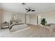 Spacious bedroom with neutral tones, ceiling fan, and a walk-in closet at 2445 Antler Point Dr, Henderson, NV 89074