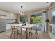 Dining area with modern lighting, sliding glass doors to patio and a view to the pool at 2445 Antler Point Dr, Henderson, NV 89074