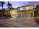Well-maintained two-story home with a three-car garage, ideal for Gathering living at 2445 Antler Point Dr, Henderson, NV 89074