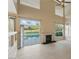 Living room with a fireplace and views of the pool at 2445 Antler Point Dr, Henderson, NV 89074