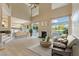 Inviting living room features a fireplace, large windows, and seamless access to outdoor spaces at 2445 Antler Point Dr, Henderson, NV 89074
