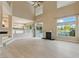 Large living room with a fireplace, hardwood floors, and seamless access to the updated kitchen at 2445 Antler Point Dr, Henderson, NV 89074