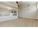 Spacious living room features wood-style flooring, neutral paint, and access to a stairway at 2445 Antler Point Dr, Henderson, NV 89074