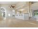Open living room with bright white floors and large windows at 2445 Antler Point Dr, Henderson, NV 89074