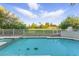 Inviting pool with turtle mosaics and white fencing overlooking lush green space, perfect for outdoor enjoyment at 2445 Antler Point Dr, Henderson, NV 89074
