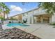Outdoor pool and spa with a covered patio and mature landscaping at 2445 Antler Point Dr, Henderson, NV 89074
