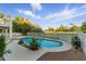 Enjoy a tranquil oasis with a private pool, surrounded by lush greenery and a charming fountain feature at 2445 Antler Point Dr, Henderson, NV 89074