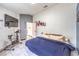 Cozy bedroom with tile floors, natural light, and simple decorations at 2744 Ironside Dr, Las Vegas, NV 89108