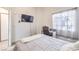 Bedroom featuring neutral wall colors, natural lighting, and a desk for working from home at 2744 Ironside Dr, Las Vegas, NV 89108