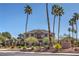 Smoke Ranch property featuring beautiful landscaping and several tall palm trees in a park-like setting at 2744 Ironside Dr, Las Vegas, NV 89108