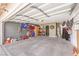 Spacious two-car garage with ample storage and shelving units for organization at 2744 Ironside Dr, Las Vegas, NV 89108
