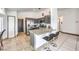 Modern kitchen with granite countertops, stainless steel appliances, and breakfast bar seating at 2744 Ironside Dr, Las Vegas, NV 89108