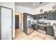 Contemporary kitchen featuring stainless steel appliances, granite counters, and gray cabinetry at 2744 Ironside Dr, Las Vegas, NV 89108