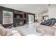 Spacious living room featuring tile floors, a fireplace, and sliding glass doors to the outside at 2744 Ironside Dr, Las Vegas, NV 89108