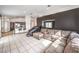 An open living room shows tile flooring, comfortable seating, and kitchen access, perfect for entertaining at 2744 Ironside Dr, Las Vegas, NV 89108