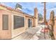 Charming backyard patio with stylish outdoor seating and a well-maintained fence at 2744 Ironside Dr, Las Vegas, NV 89108