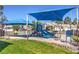 Community playground featuring slides and shaded seating areas, perfect for outdoor Gathering fun and recreation at 2744 Ironside Dr, Las Vegas, NV 89108